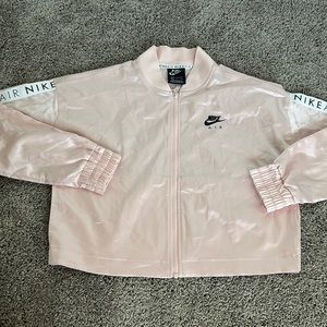 One of one pink Nike cropped tracksuit